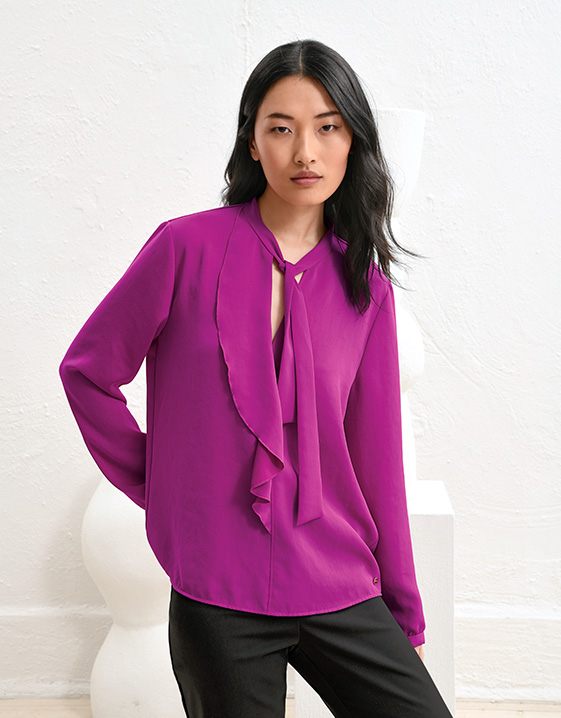 Damesblouses voor elk figuur: de blouse met ruches
